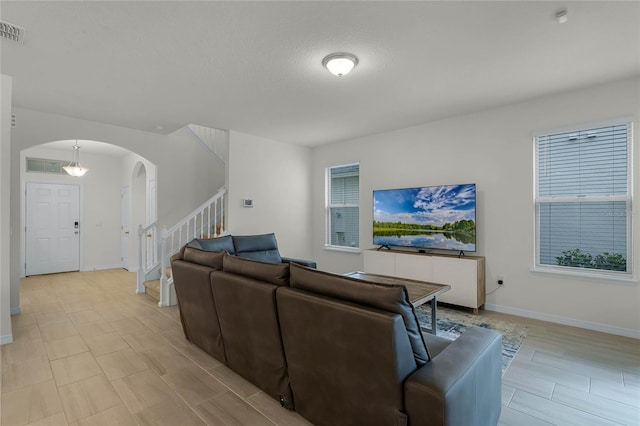 living room featuring plenty of natural light and a textured ceiling