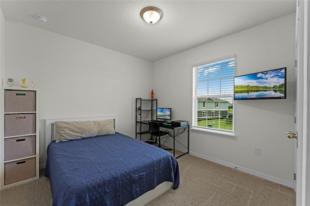 bedroom featuring carpet