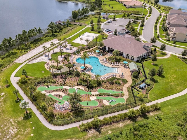 birds eye view of property with a water view