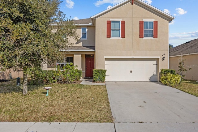 view of front of home featuring a garage and a front lawn