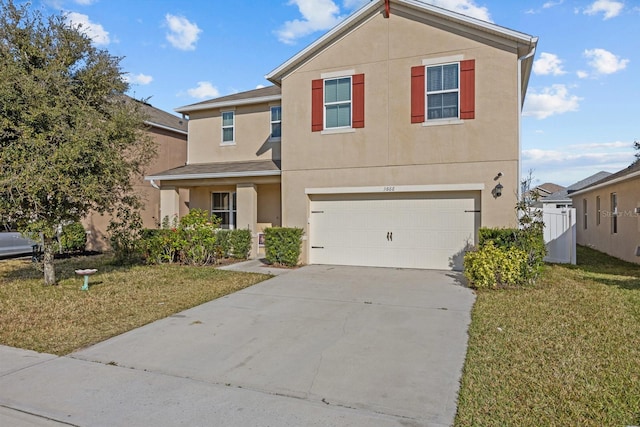 view of front facade featuring a garage and a front lawn