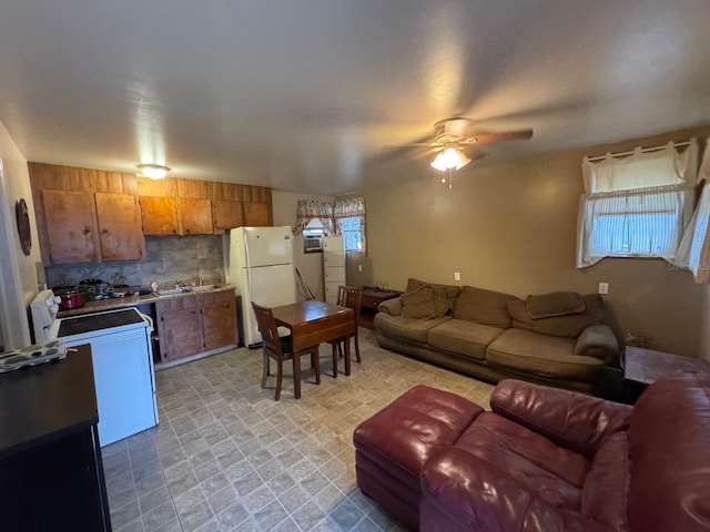 living room featuring sink and ceiling fan