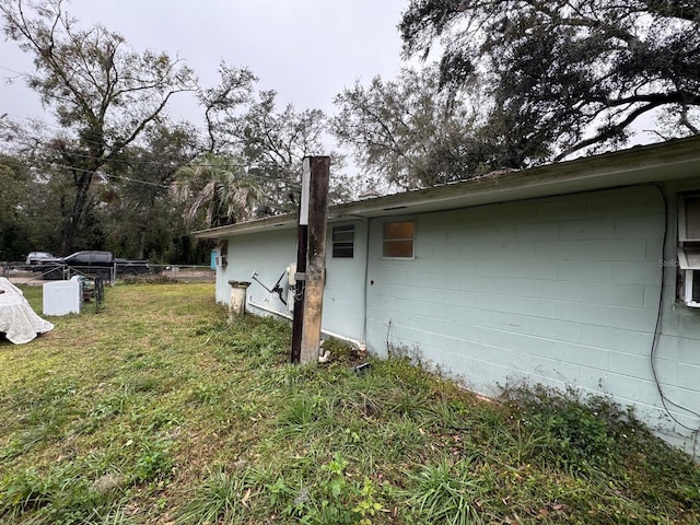 view of home's exterior with a yard