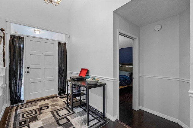 foyer with dark hardwood / wood-style flooring