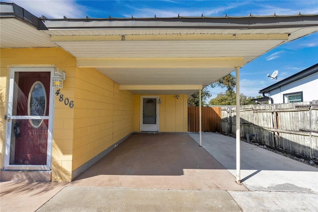 entrance to property featuring a carport