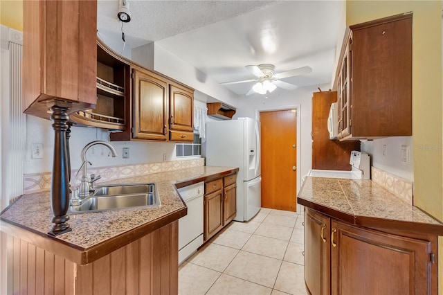 kitchen with sink, white appliances, a textured ceiling, light tile patterned floors, and ceiling fan