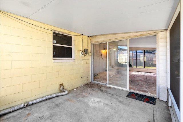 entrance to property featuring a patio area