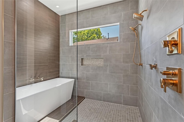 bathroom with separate shower and tub