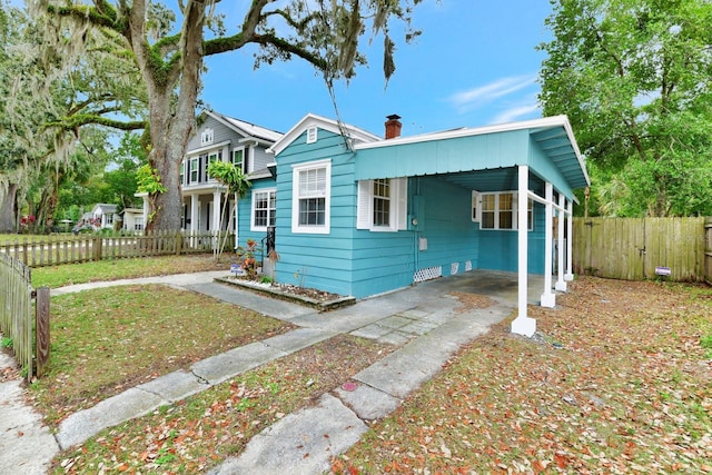 view of front of house featuring a carport