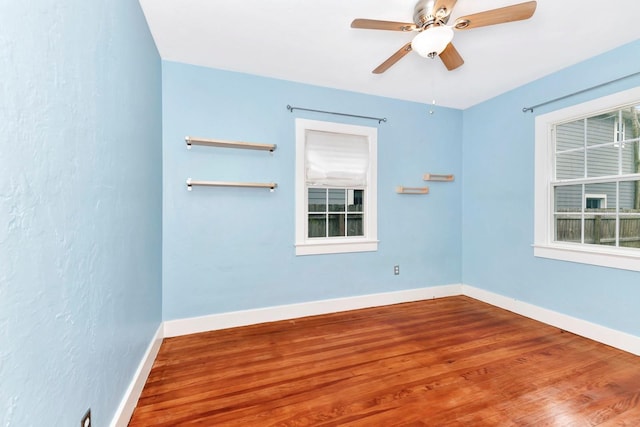 unfurnished room featuring hardwood / wood-style flooring and ceiling fan