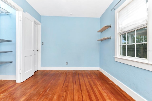 unfurnished room featuring wood-type flooring