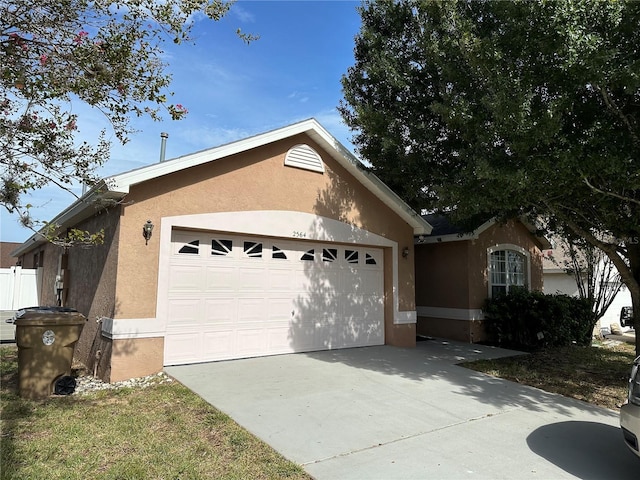 ranch-style house featuring a garage