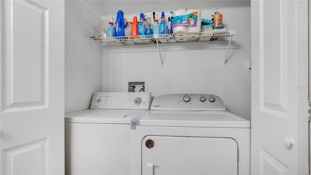 washroom featuring independent washer and dryer