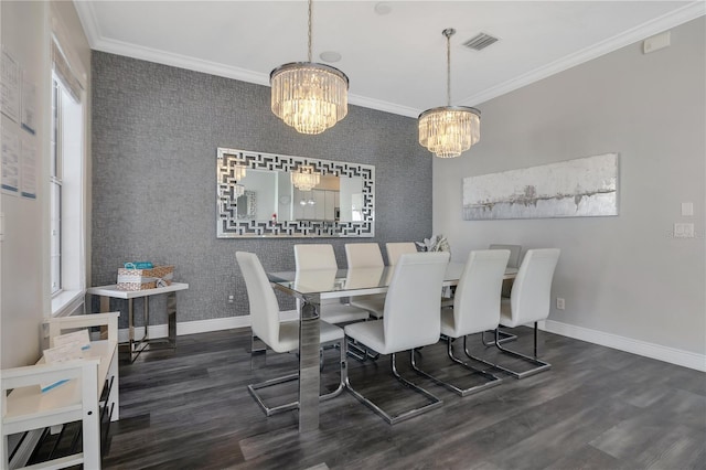 dining room featuring ornamental molding, dark wood-type flooring, and an inviting chandelier