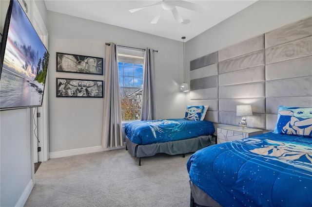 carpeted bedroom featuring ceiling fan