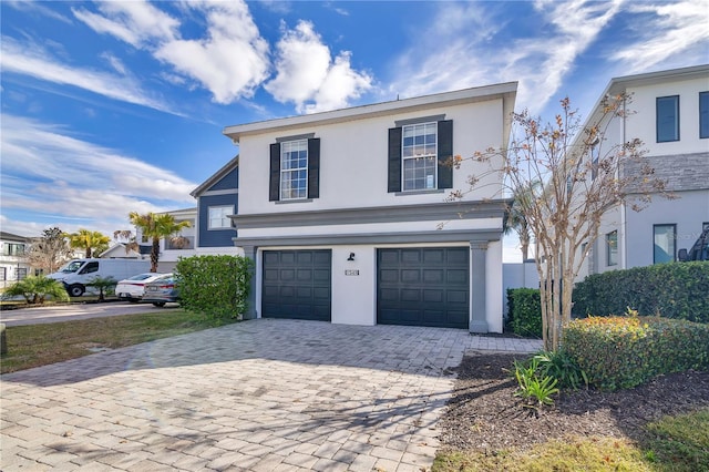 front facade with a garage