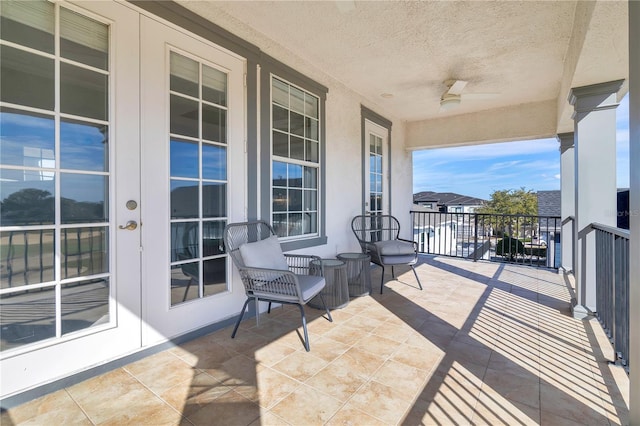 balcony featuring french doors and ceiling fan