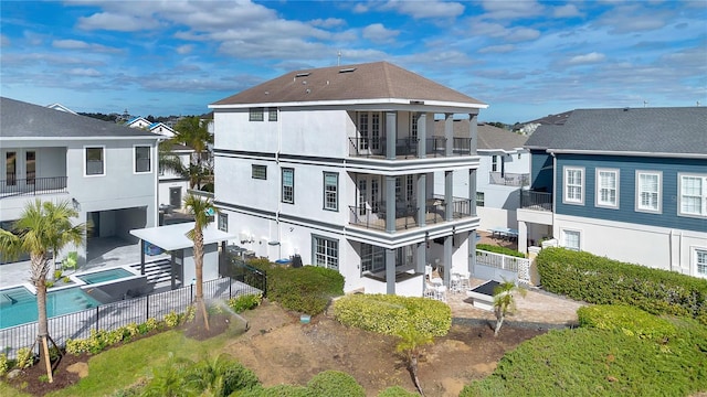 rear view of property with a balcony