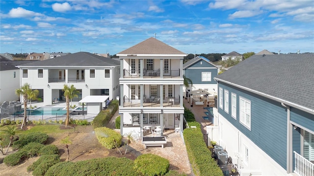 back of house with a balcony