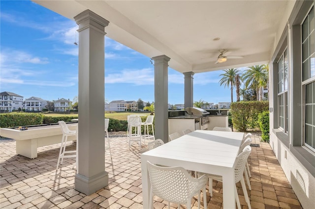 view of patio / terrace featuring an outdoor kitchen, a grill, and ceiling fan