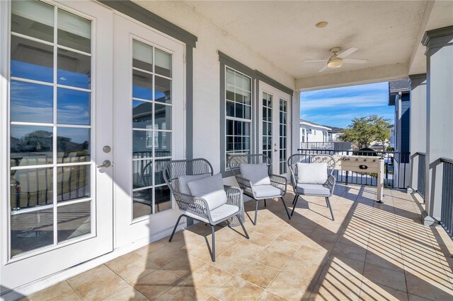 balcony with french doors and ceiling fan