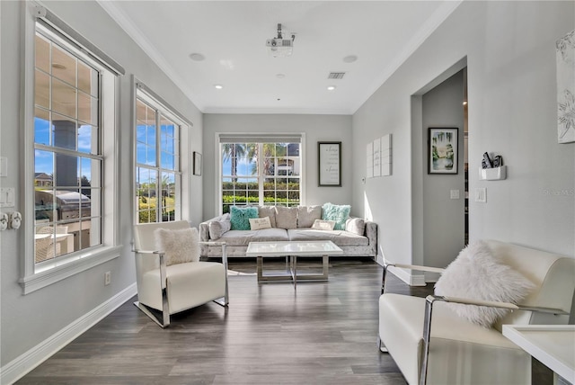 living room featuring ornamental molding and dark hardwood / wood-style flooring