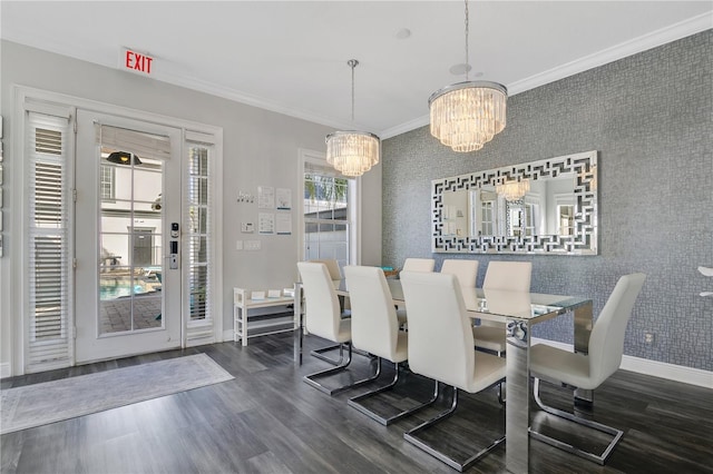 dining area featuring an inviting chandelier, crown molding, and dark wood-type flooring