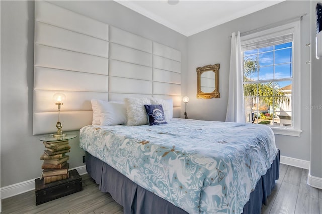 bedroom featuring wood-type flooring