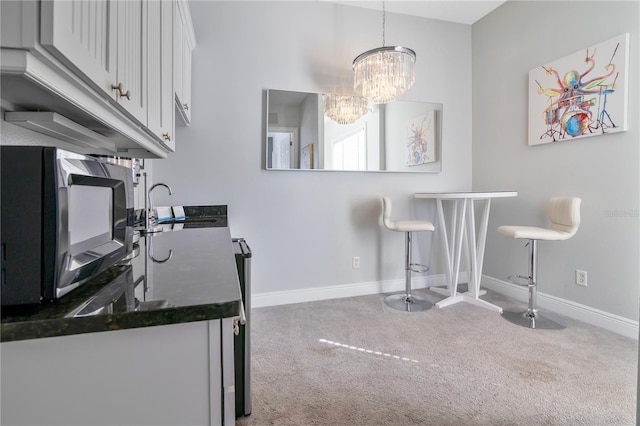 interior space with sink and an inviting chandelier