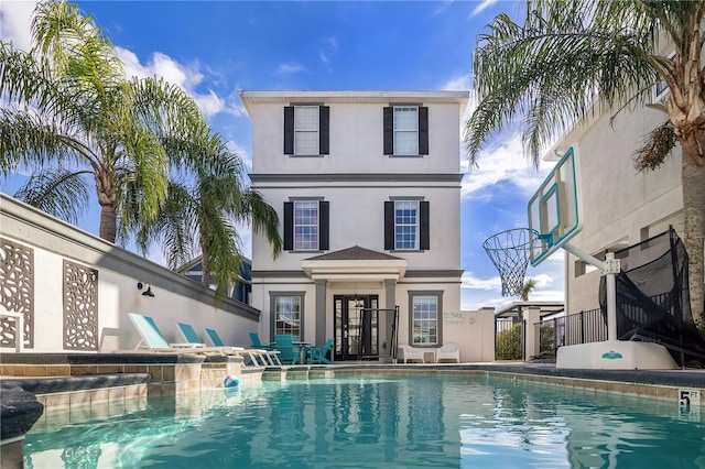 view of swimming pool featuring a patio area