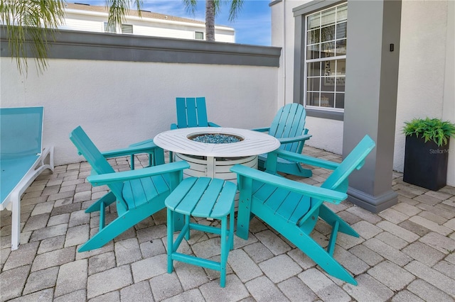 view of patio / terrace with a fire pit