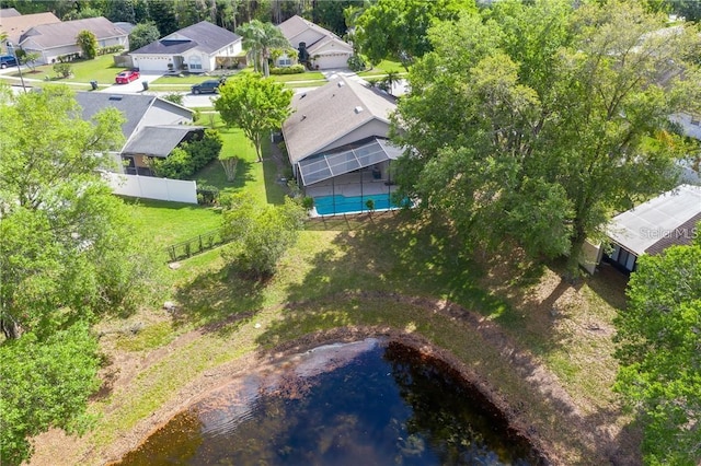 birds eye view of property with a water view