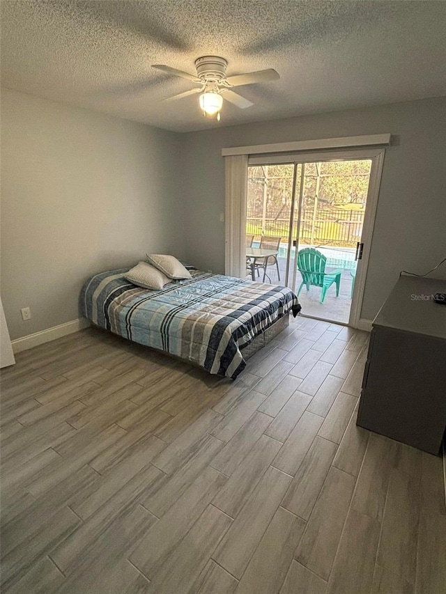 bedroom featuring ceiling fan and access to outside