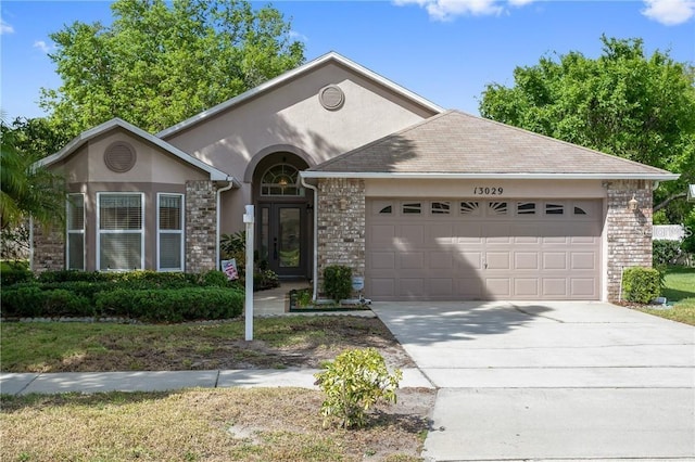 ranch-style house featuring a garage