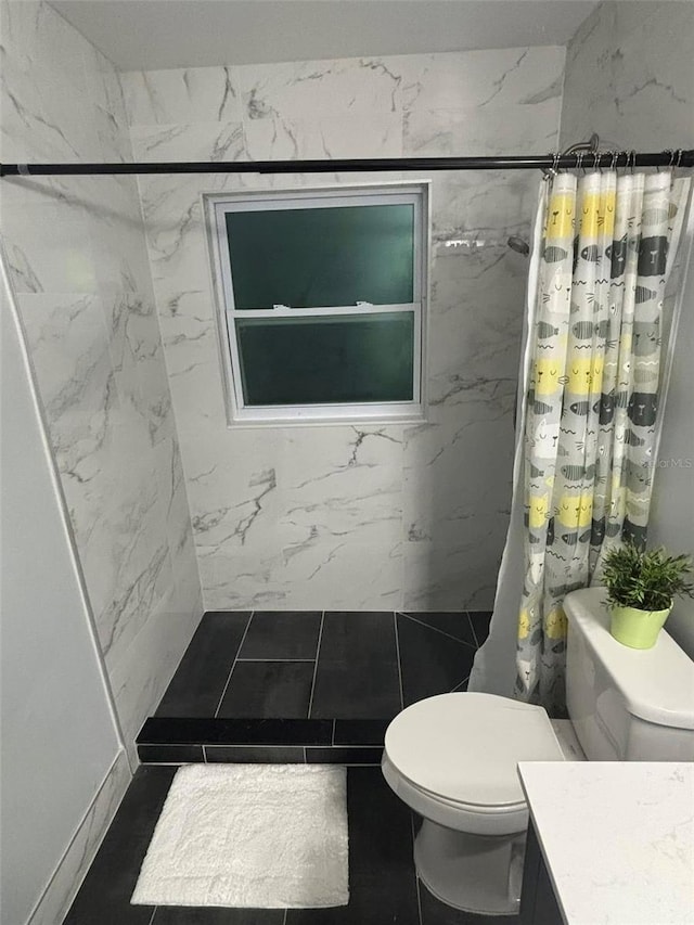 bathroom with vanity, tile patterned flooring, curtained shower, and toilet