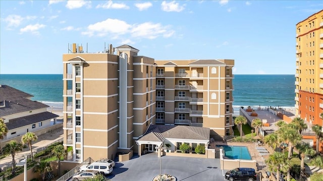 view of building exterior with a water view