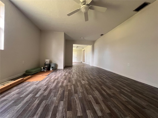 spare room featuring dark hardwood / wood-style floors and ceiling fan