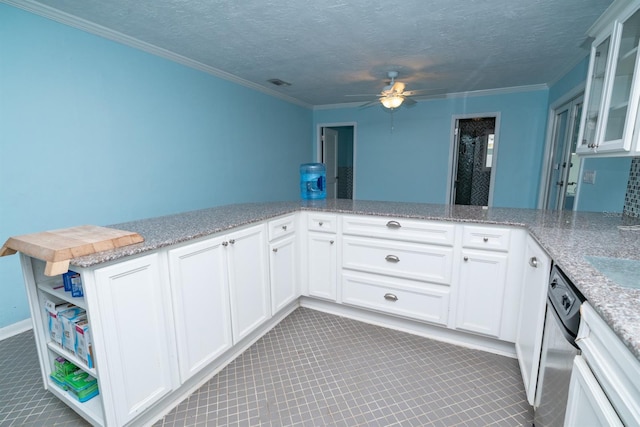 kitchen featuring light stone countertops, white cabinets, ornamental molding, kitchen peninsula, and ceiling fan