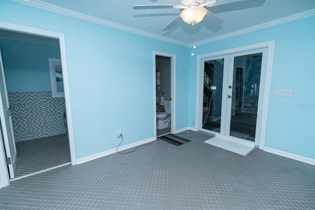 spare room with crown molding and ceiling fan