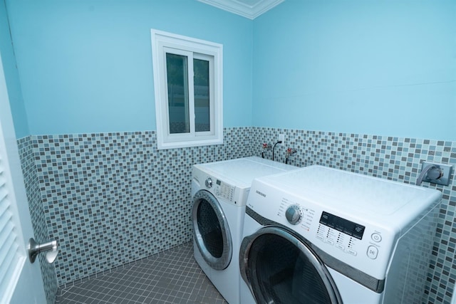 laundry area featuring washer and dryer, tile walls, tile patterned floors, and ornamental molding