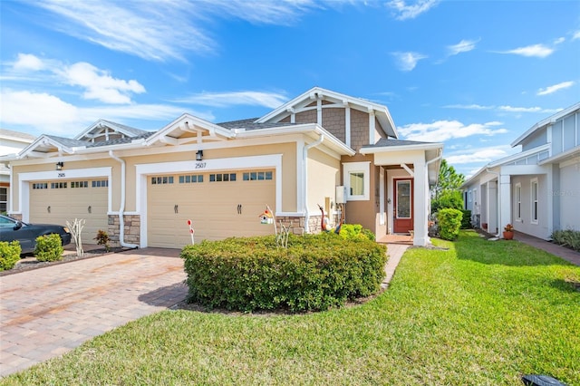 view of front of house featuring a garage and a front lawn