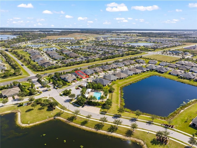 birds eye view of property with a water view