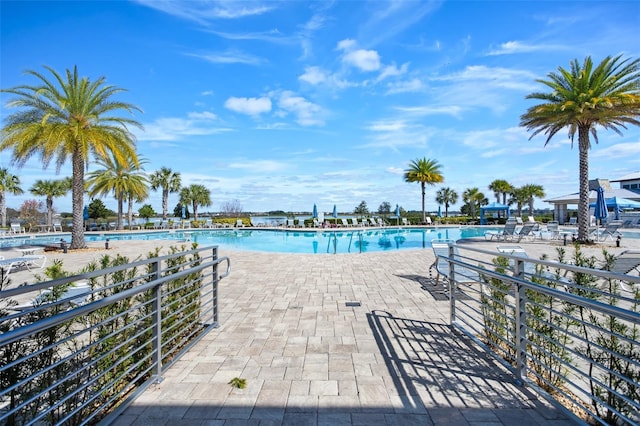 view of swimming pool with a patio