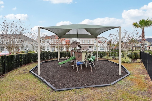 view of playground with a lawn