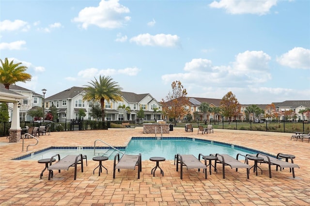 view of swimming pool with a patio area