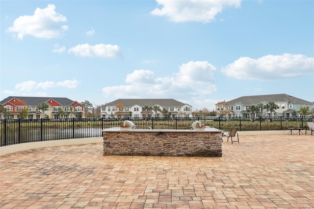 view of patio / terrace with a bar and a water view