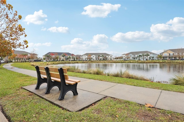 exterior space with a yard and a water view