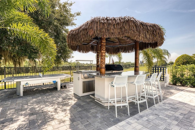 view of patio / terrace with area for grilling and exterior bar