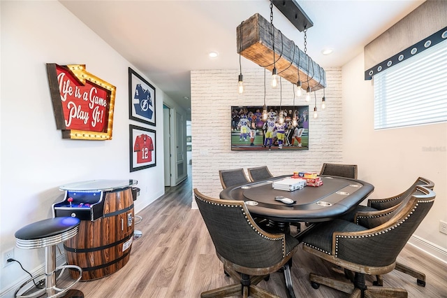 dining area with hardwood / wood-style flooring