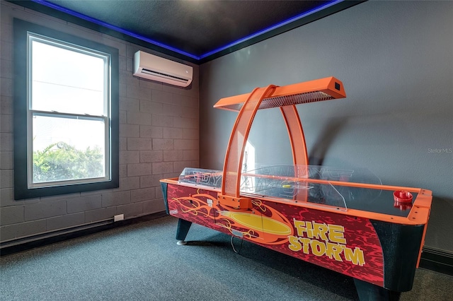 playroom featuring carpet, a wall unit AC, and a wealth of natural light